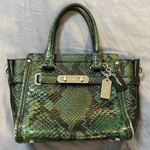 Super stunning used small Coach handbag.